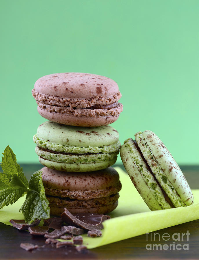 Chocolate and mint flavor macaroons on dark wood table #4 Photograph by Milleflore Images