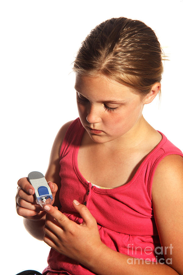 Diabetic Child With Blood Glucose Tester #4 Photograph by Ted Kinsman