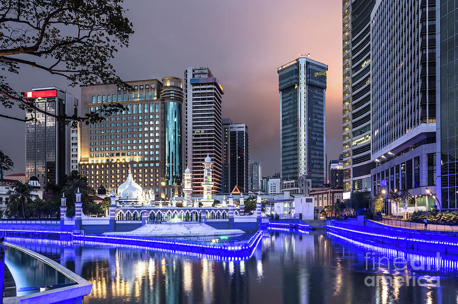 The office buildings reflects in the water of the Klang river in #4 Photograph by Didier Marti
