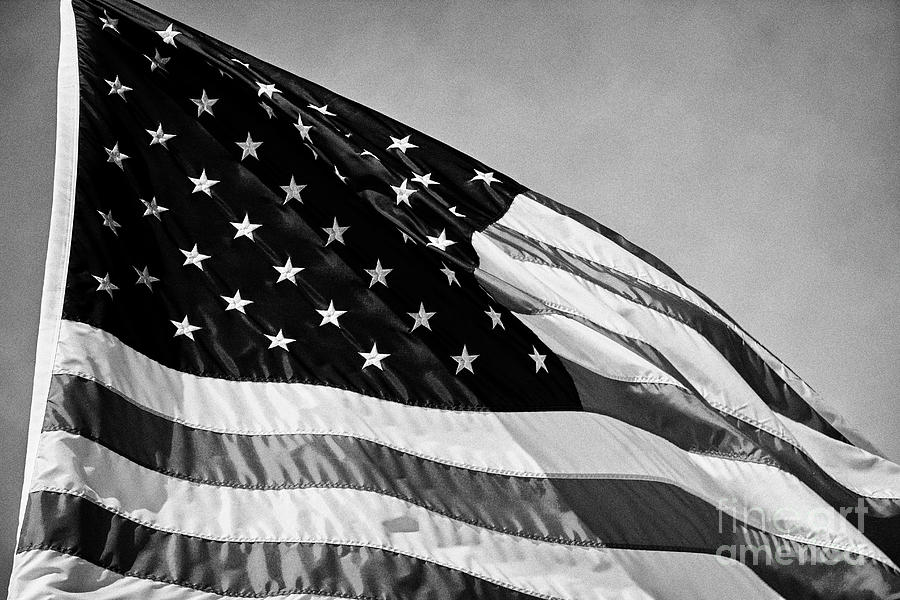 us flag flying against blue sky Washington DC USA #4 Photograph by Joe ...