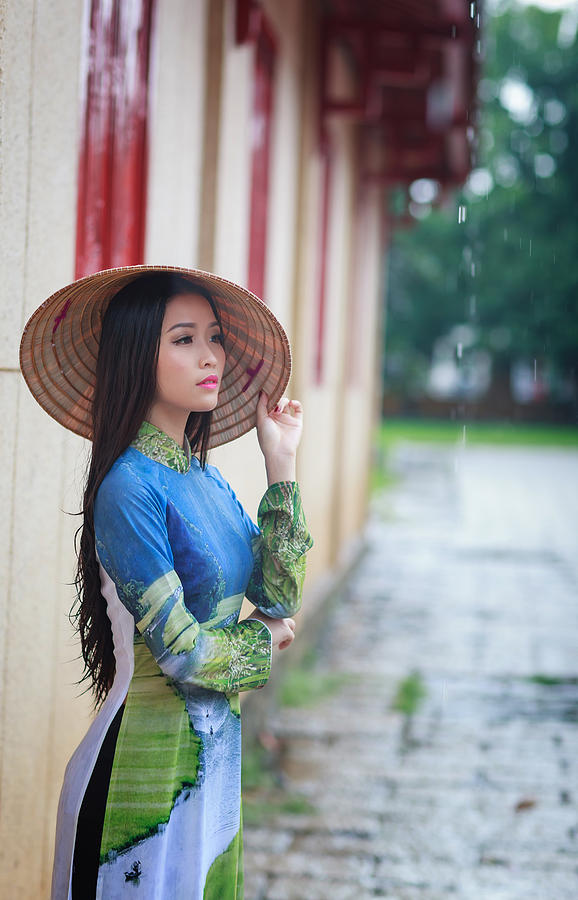 Pretty Girl In Vietnam Ao Dai Is Famous Traditional Costume Stock Photo ...