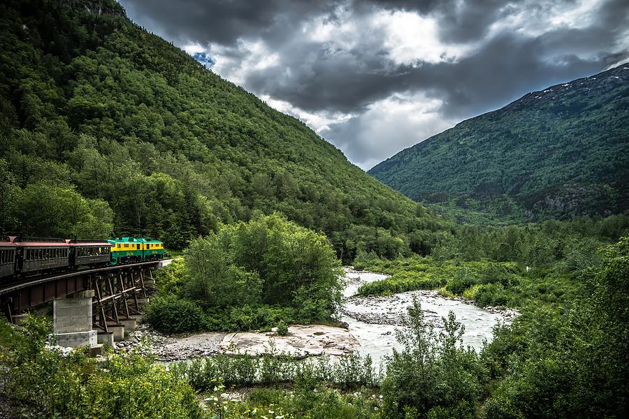 The White Pass and Yukon Route on train passing through vast lan #40 Photograph by Alex Grichenko