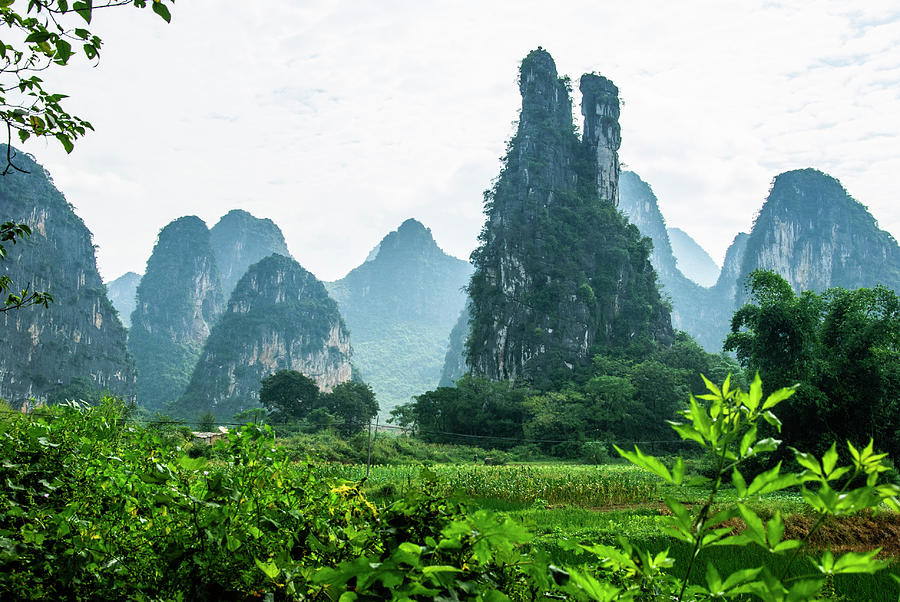 Karst mountains and  rural scenery #48 Photograph by Carl Ning