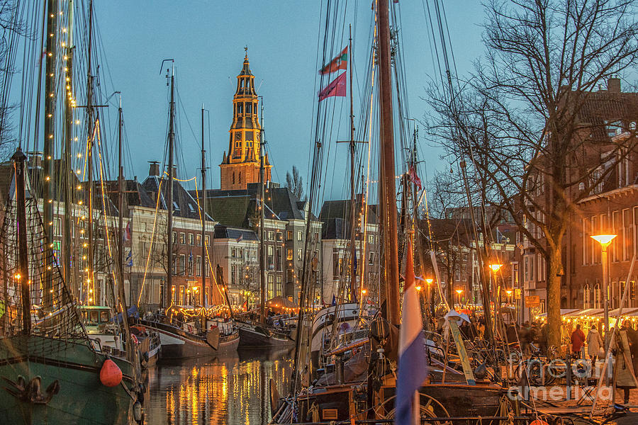 Groningen at night with boats and lights Photograph by Patricia Hofmeester