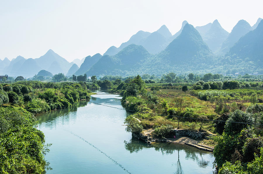 The karst mountains and river scenery #5 Photograph by Carl Ning