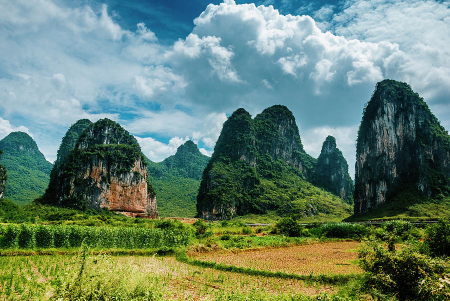 Karst mountains and  rural scenery #52 Photograph by Carl Ning