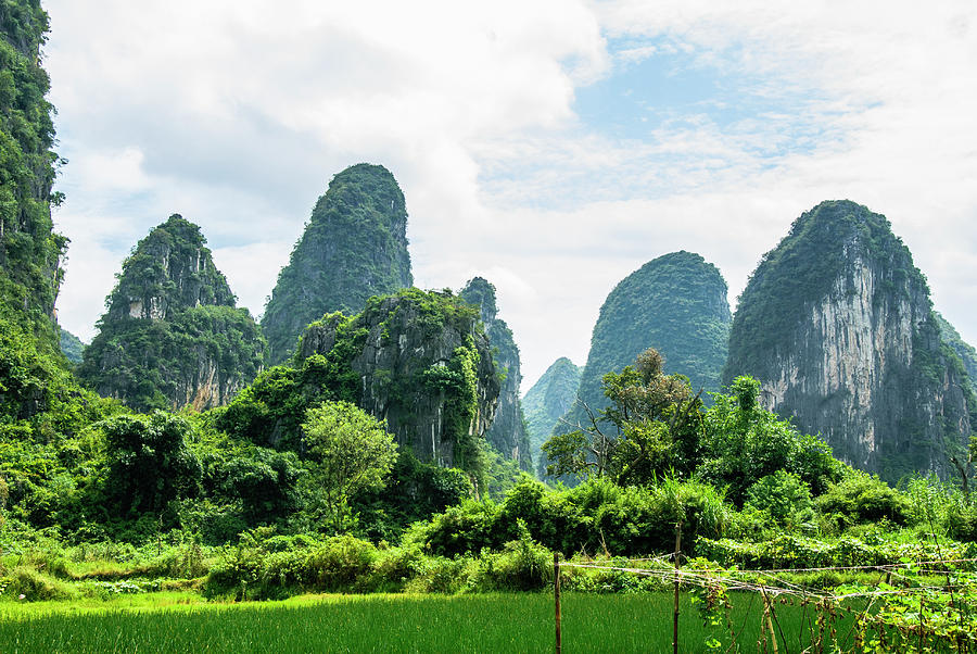 Karst mountains and  rural scenery #54 Photograph by Carl Ning