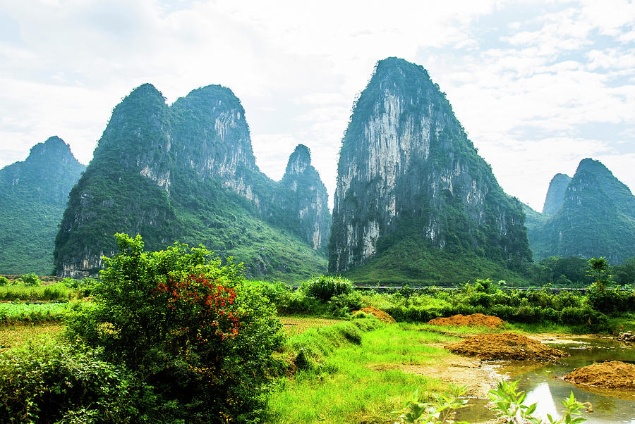 Karst mountains and  rural scenery #57 Photograph by Carl Ning