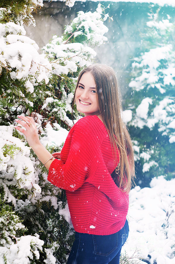 Winter Photograph - Beautiful young girl model in winter in a parked park. in a red sweater. #6 by Oleksandr Masnyi