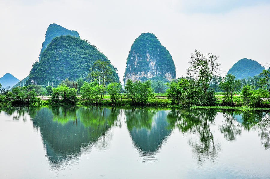 Karst mountains and rural scenery #6 Photograph by Carl Ning