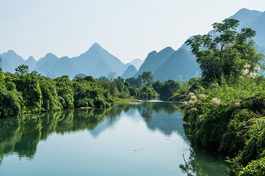 The karst mountains and river scenery #6 Photograph by Carl Ning