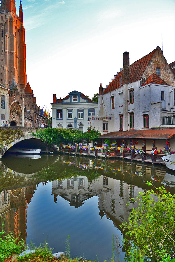 The Quiet Waters Of The Canals Of Bruges. Photograph