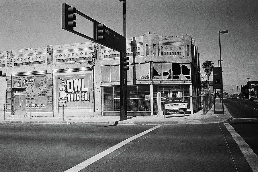 6th and Congress 1930s era Owl Drug wall sign Hotel Congress in background Tucson Arizona 1989 Photograph by David Lee Guss