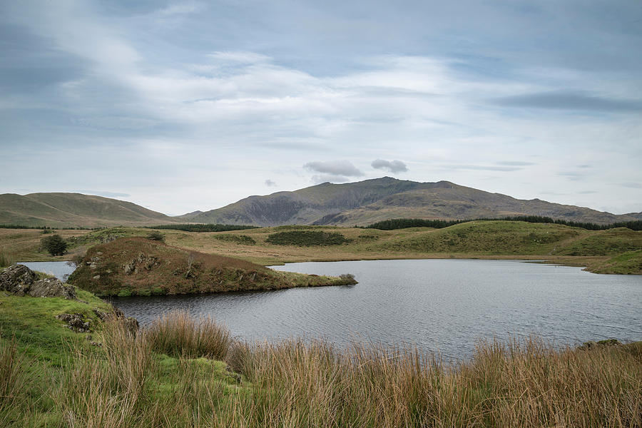 Evening landscape image of Llyn y Dywarchen lake in Autumn in Sn