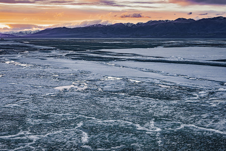 Scenic view of frozen wild lake under stormy sky Photograph by Oleg ...