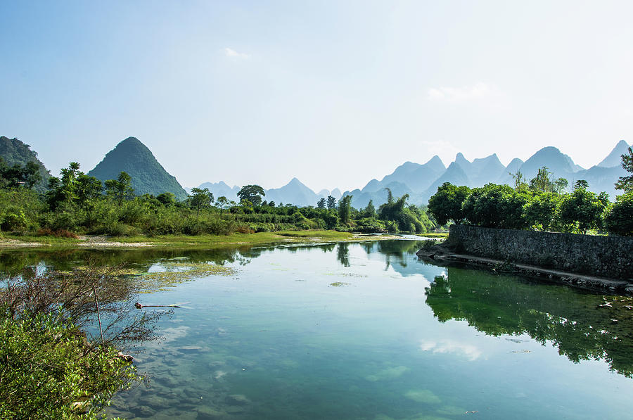 The karst mountains and river scenery #7 Photograph by Carl Ning