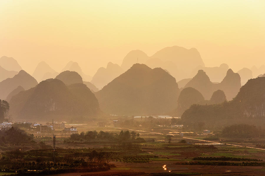 Karst mountains scenery in sunset #8 Photograph by Carl Ning