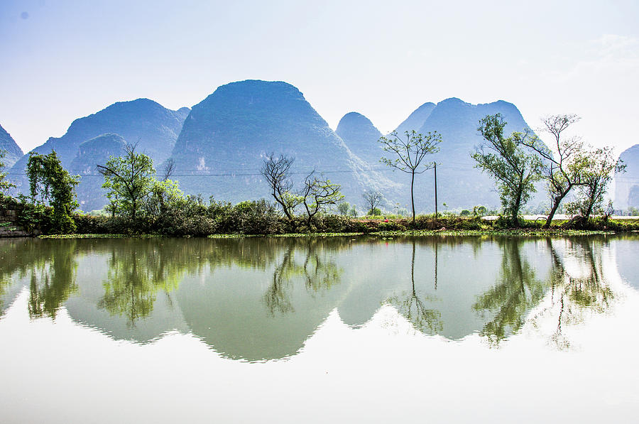 Karst mountains and rural scenery #9 Photograph by Carl Ning