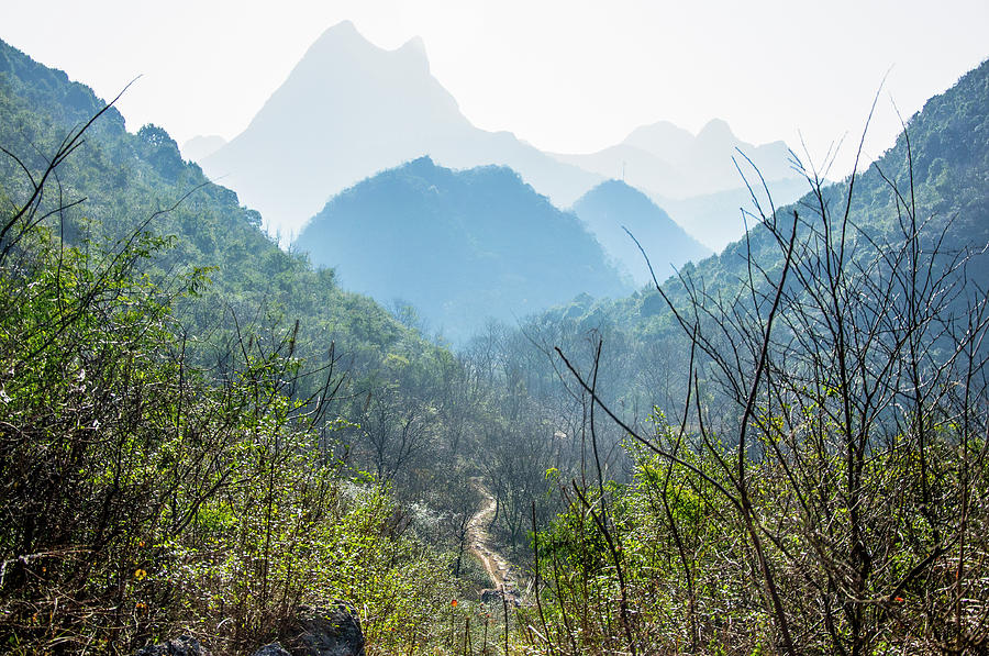 Karst mountains scenery in winter #9 Photograph by Carl Ning