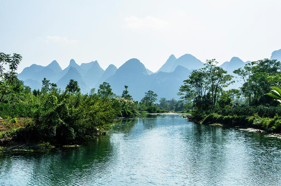 The karst mountains and river scenery #9 Photograph by Carl Ning