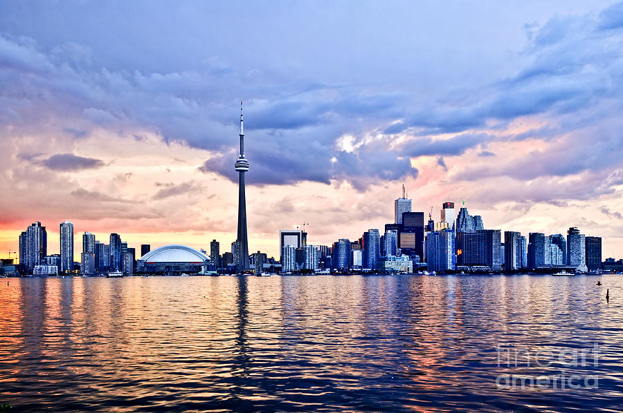 Toronto skyline reflecting in Lake Ontario Photograph by Elena Elisseeva