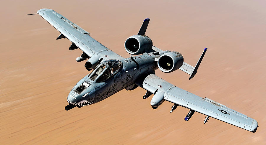 A-10 Thunderbolt II over the desert Photograph by Weston Westmoreland