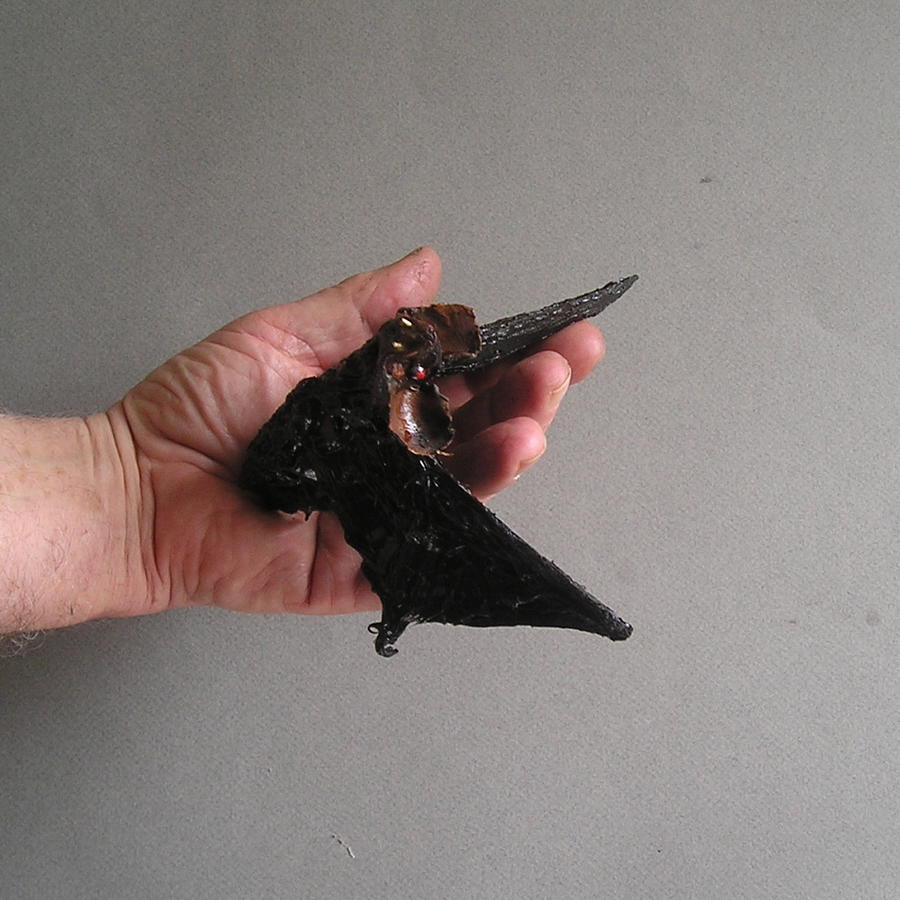 A Bat in the Hand Mixed Media by Roger Swezey
