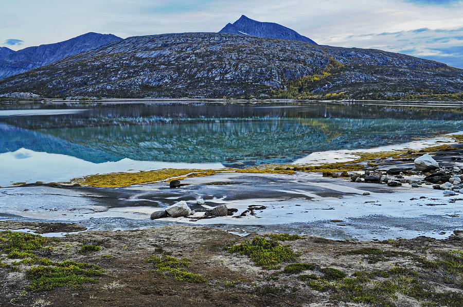 Summer Photograph - A bleak mountain is reflected in the calm water of a fjord by Ulrich Kunst And Bettina Scheidulin