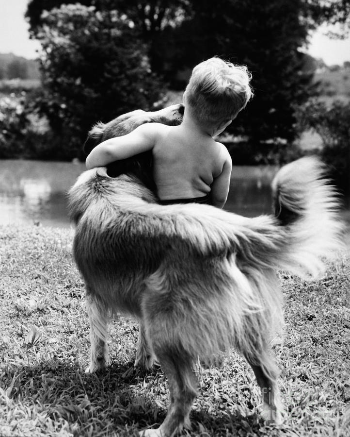 Animal Photograph - A Boy And His Dog, C. 1950s by H Armstrong Roberts ClassicStock