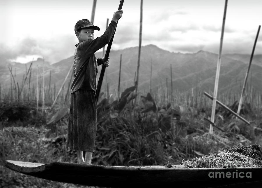 Black And White Photograph - A boy on Inle Lake by RicardMN Photography