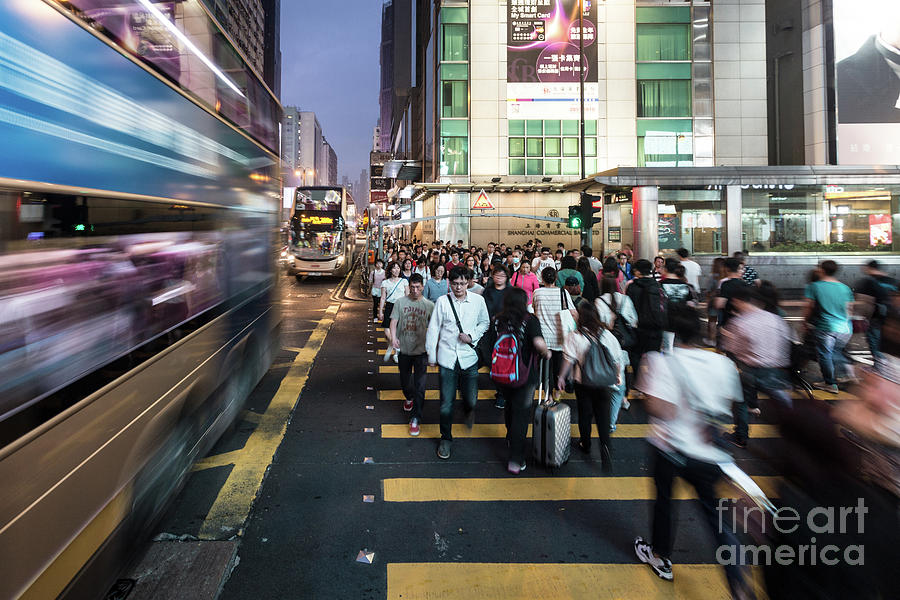 A bus rushing through Mongkok in Hong Kong Photograph by Didier Marti