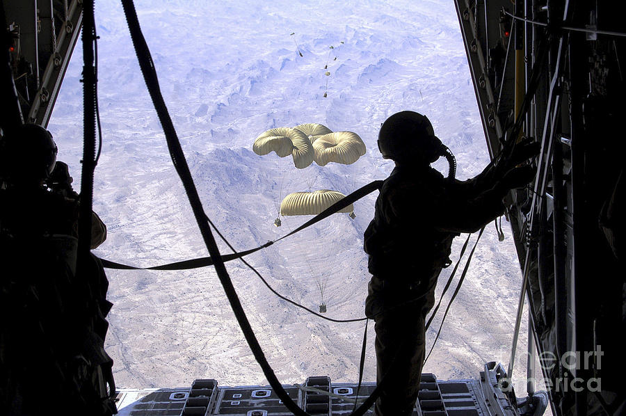 A C-130 Hercules Loadmaster Observes Photograph by Stocktrek Images