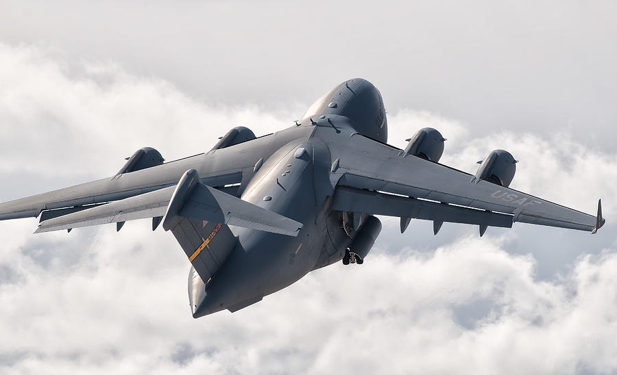 A C-17 Globemaster Flying Photograph by Giovanni Colla