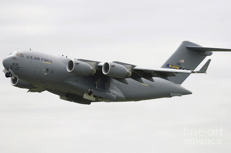 Airplane Photograph - A C-17 Globemaster IIi In Flight by Stocktrek Images