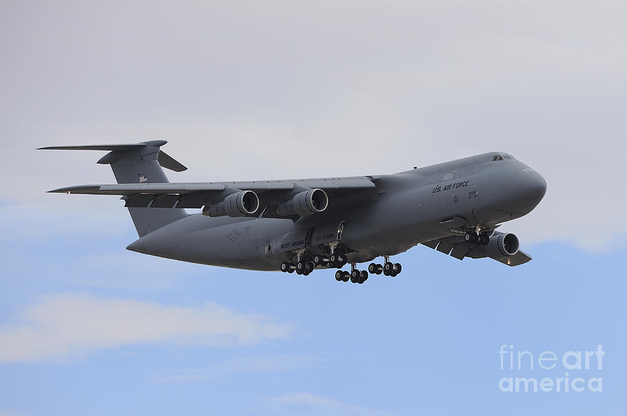 Transportation Photograph - A C-5 Galaxy In Flight Over Nevada by Remo Guidi