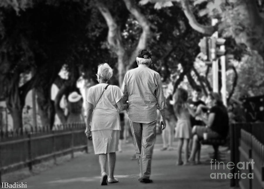 elderly couple walking black and white
