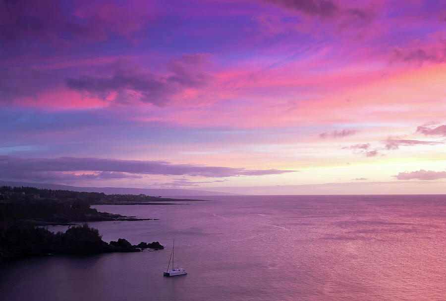 Nature Photograph - A Catamaran in Honolua Bay at Sunset, Maui, Hawaii by Derrick Neill