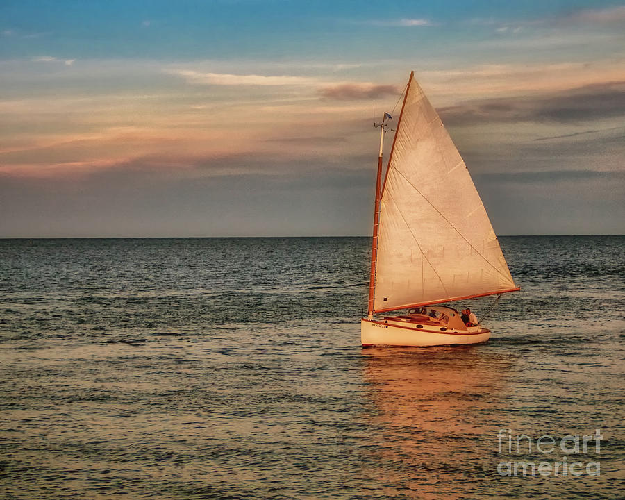 A Catboat in Full Sail at Sunset Photograph by Robert Anastasi