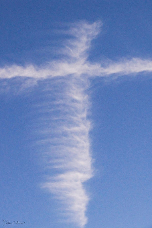 A Cloud that looks like a Cross Photograph by John Harmon