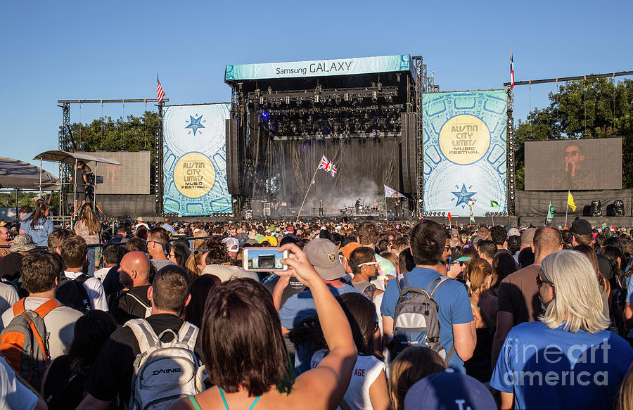 Music Photograph - A concert goer snaps a photo of the stage during the Austin City Limits Music Festival by Dan Herron