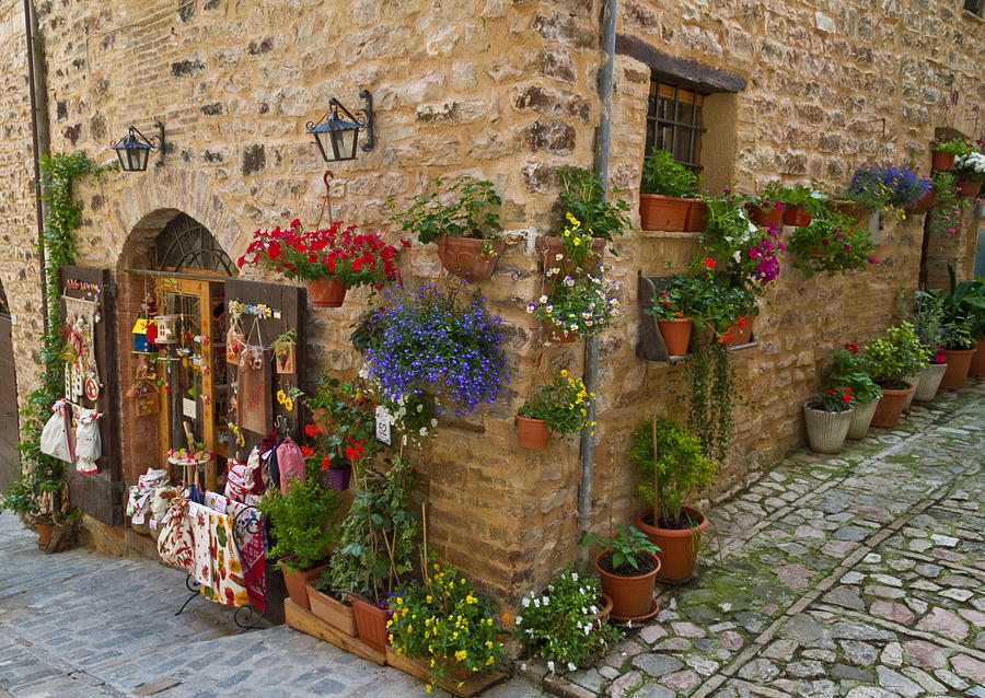 A corner store in Spello Italy Photograph by Roger Mullenhour