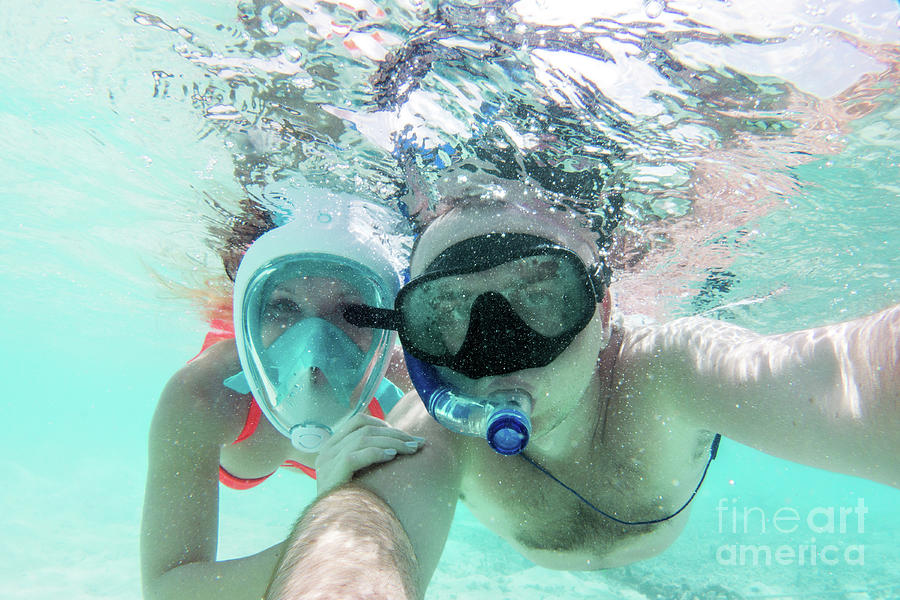 A couple in love taking selfie underwater in Indian Ocean, Maldives Photograph by Michal Bednarek