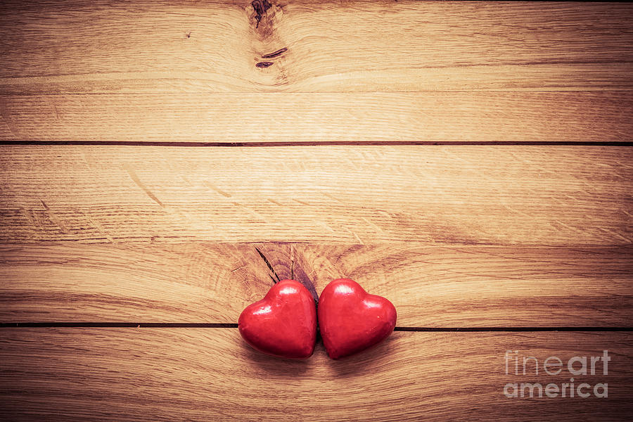 A couple of red little hearts on wood Photograph by Michal Bednarek