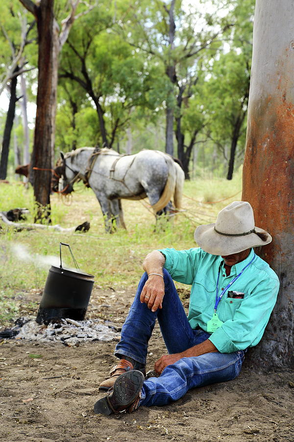 A cowboy naps during smoko break. Photograph by Andrew McInnes