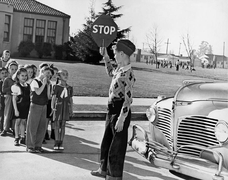 A Crossing Guard Holds Up Sign Photograph by Underwood Archives