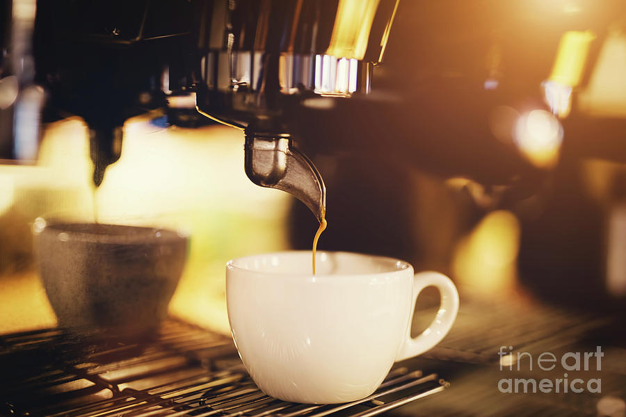 A cup of coffee straight from a coffee machine. Photograph by Michal Bednarek