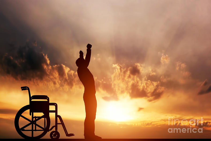 Sunset Photograph - A disabled man standing up from wheelchair by Michal Bednarek