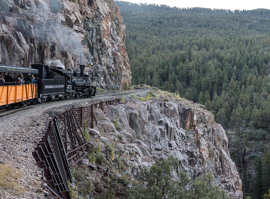 A Durango and Silverton Narrow Gauge Scenic Railroad train along a San Juan Mountains precipice Photograph by Carol M Highsmith
