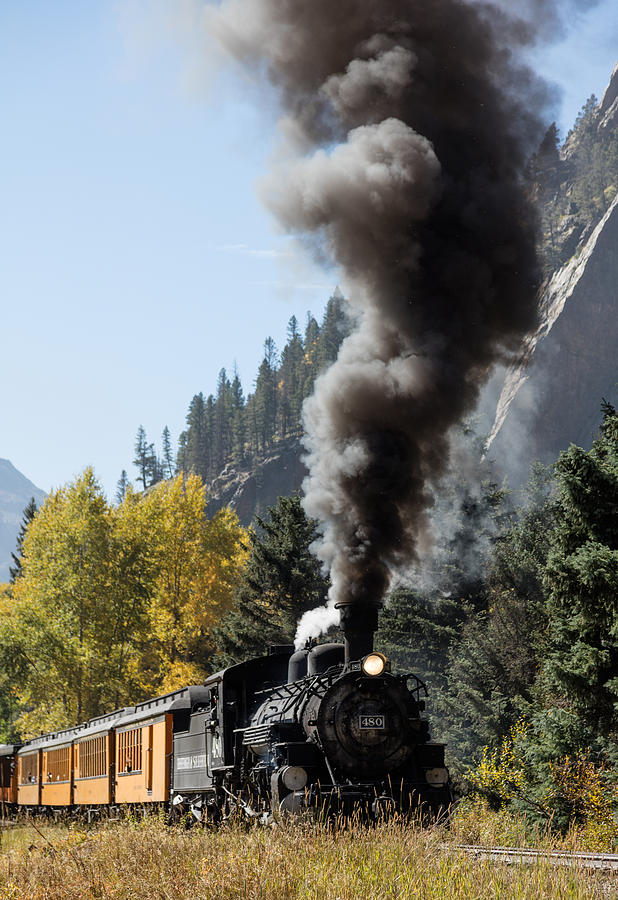 A Durango and Silverton Narrow Gauge Scenic Railroad train chugs through the San Juan Mountains Photograph by Carol M Highsmith