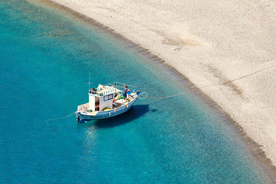 A fishing boat in Agios Minas beach of Karpathos - Greece Photograph by Constantinos Iliopoulos